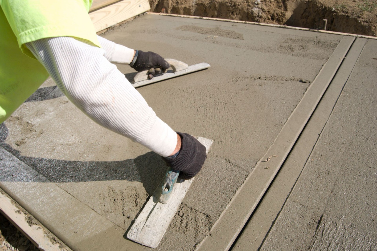 Hand trowel finishing fresh concrete in Pickering