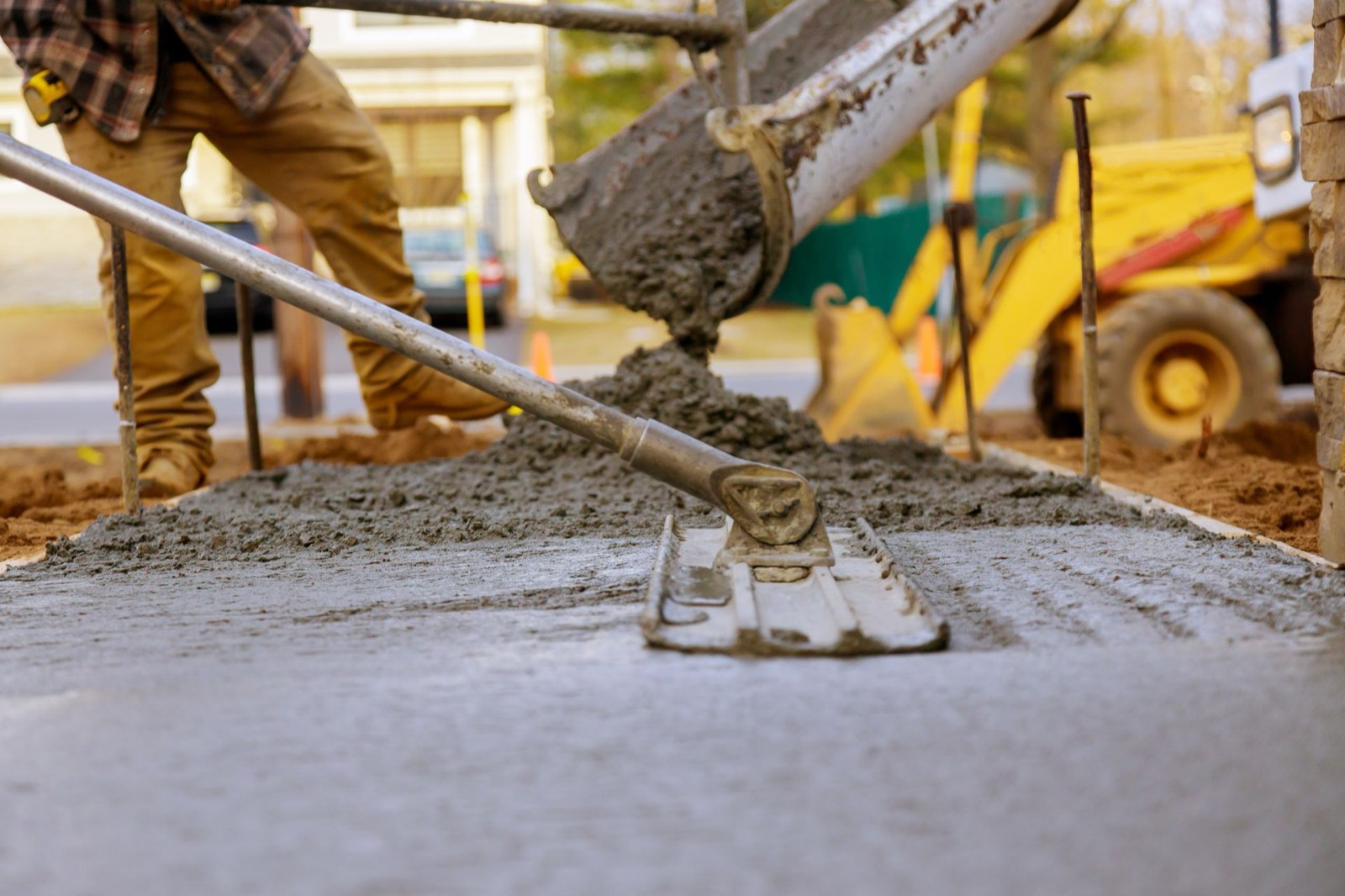Fresh concrete pouring at a Toronto replacement job