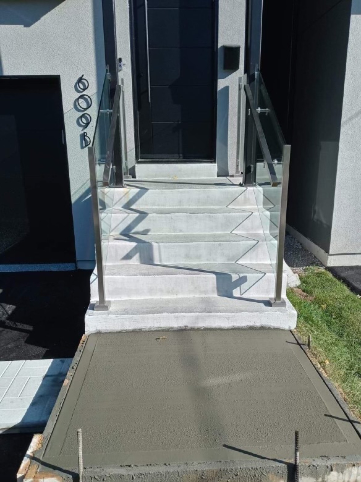Concrete steps and slab at the front entrance of a Toronto home